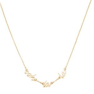 kate spade statement necklace in gold that reads “ooh la la”